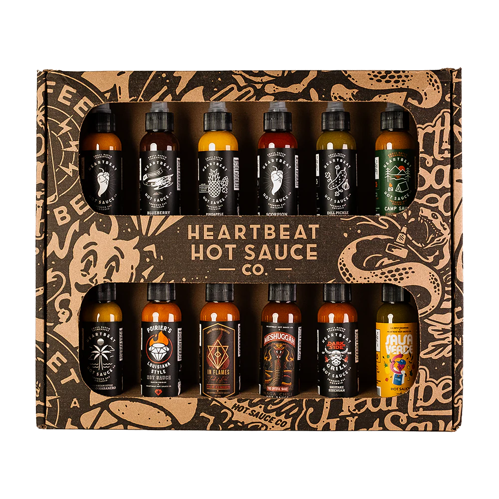 Heartbeat 12 Mini Pack degustacijski komplet z dvanajstimi mini craft pekočimi omakami različnih stilov, od sadnih habanero omak do verde in garlic variant.