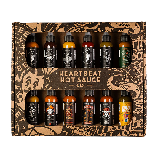 Heartbeat 12 Mini Pack degustacijski komplet z dvanajstimi mini craft pekočimi omakami različnih stilov, od sadnih habanero omak do verde in garlic variant.