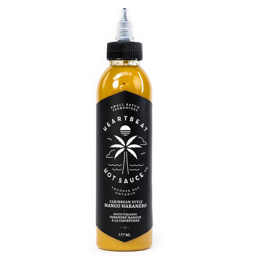 Heartbeat Carribean Style Mango Habanero je sadna, tropska pekoča omaka z mangom in habanero čiliji.