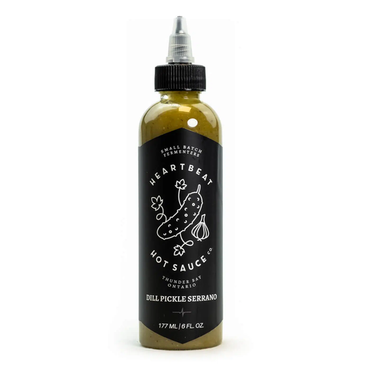 Heartbeat Dill Pickle Serrano je pekoča omaka z okusom kislih kumaric, kopra in Serrano čilijev.