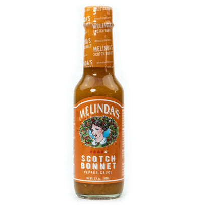 Melinda’s Scotch Bonnet je sadno pikantna omaka s čiliji Scotch Bonnet, papajo in pasijonko, idealna za karibsko kuhinjo, koktajle in mesne jedi.